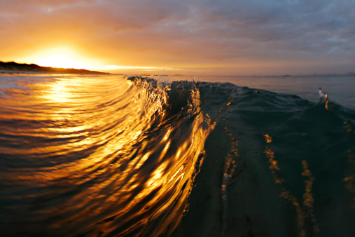 Detail shot of a wave breaking at sunset in Esperance, Western Australia.