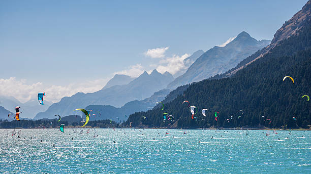 istock Kitesurfing and Windsurfing in a Mountain Lake 486765876
