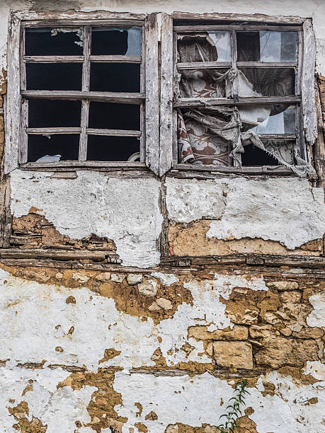 istock windows of an abandoned house 486766522
