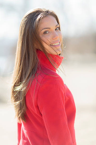 istock Pretty young woman in red coat 486767445