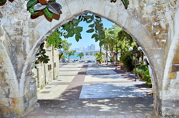 The Acre surrounding wall gate with small view of the mediterranean sea water