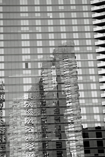 Las Vegas, United Kingdom - April 5, 2014: Reflection of the Aria hotel in the Harmon hotel windows in late afternoon.