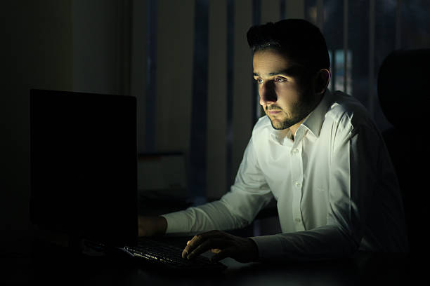 Late night working on computer stock photo