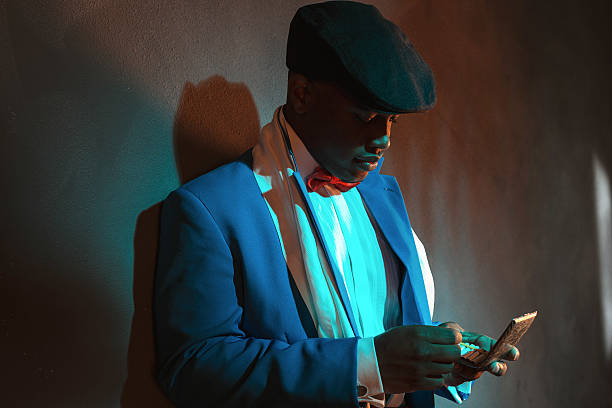 istock Retro african american man picking cigarette out of box. 486774248