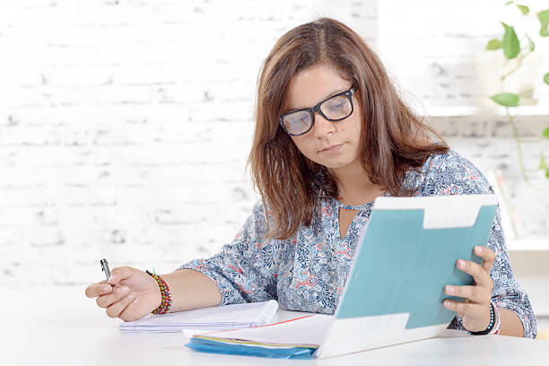 istock teenager working homework 486778198