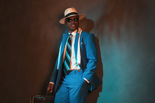 istock African american traveller in blue suit wearing straw hat. 486778356