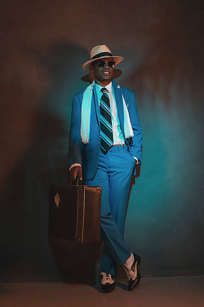 istock African american traveller in blue suit wearing straw hat. 486778816