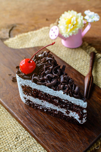 istock Black Forest, Chocolate cake on wooden table 486779102