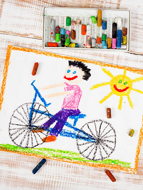 istock colorful drawing: boy riding bike 486779586