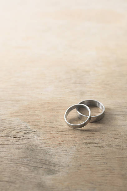 istock Vintage image with rings on rustic wood board 486780842