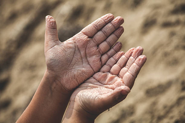 Wet hands Wet folded hands on the beach lepro stock pictures, royalty-free photos & images