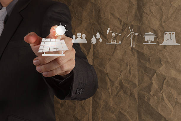 istock hand point solar cell icon with crumpled recycle paper backgroun 486785401