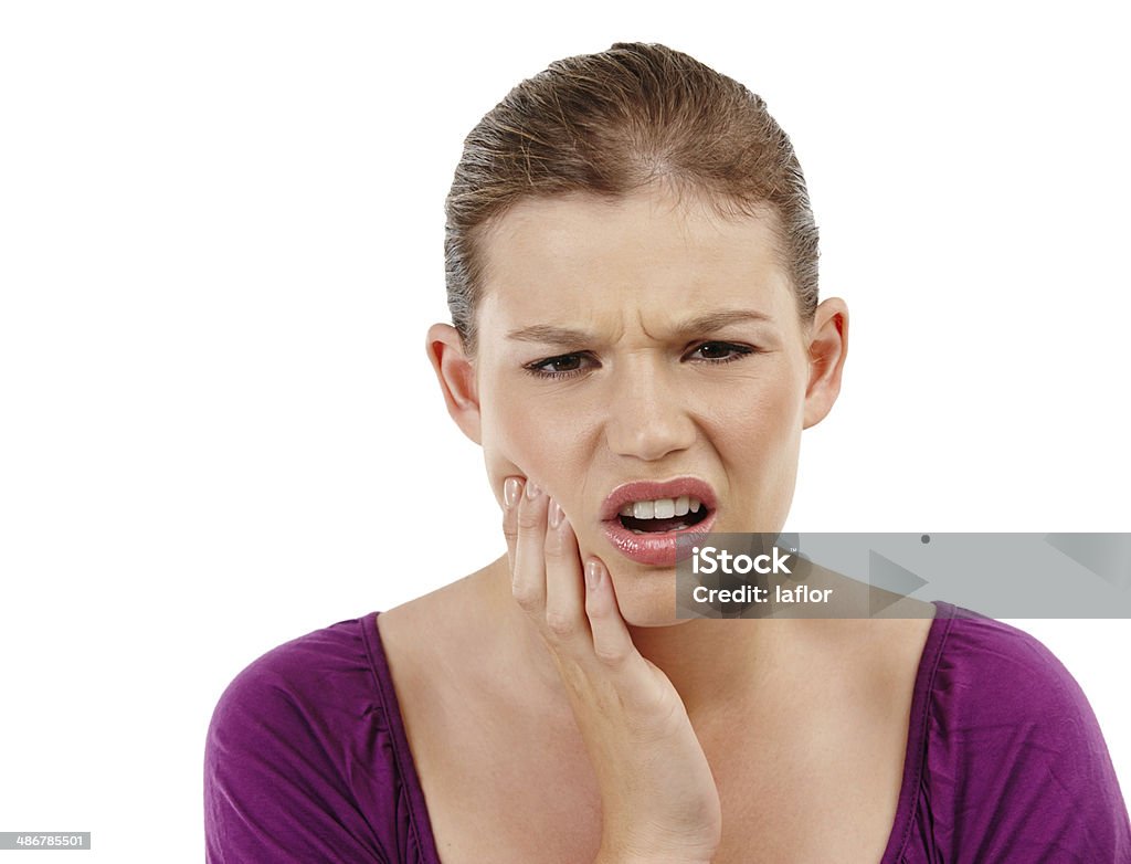 Toothache is the worst! A teenage girl with a toothache One Woman Only Stock Photo