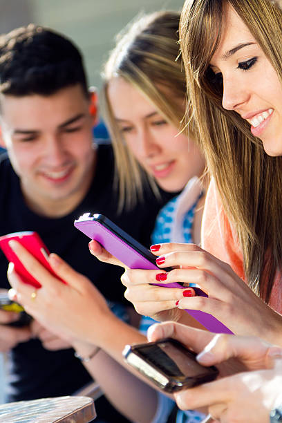 istock Friends having fun with smartphones 486785725