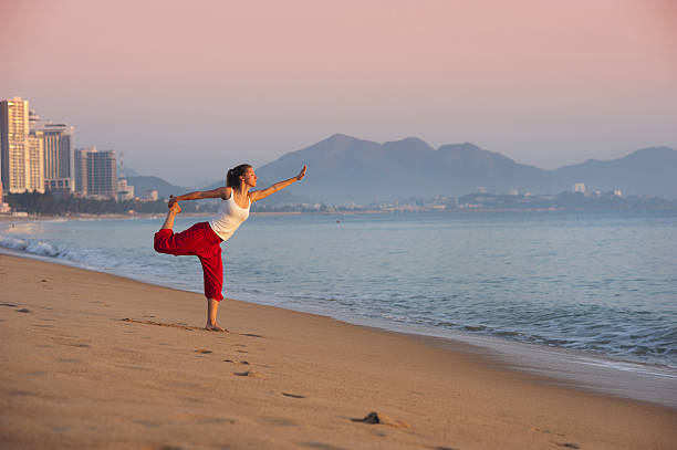 istock Sport woman doing exercise at the city beach. 486787241