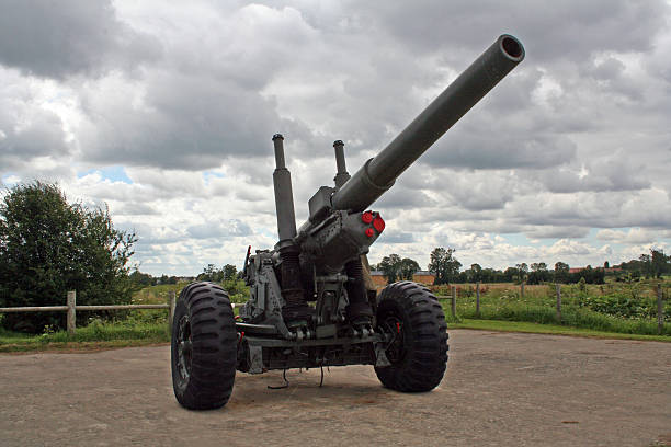 France: Merville Battery WWII Site Merville, France - July 23, 2006: Artillery gun at the Merville Battery was a part of the Nazi's Atlantic Wall to protect the Normandy beaches from invasion. The British Airborne did an airdrop at midnight on D-Day and attacked the battery and took it out of commission before the landings six hours later. The site is now a monument to the men who captured the position. battleground stock pictures, royalty-free photos & images