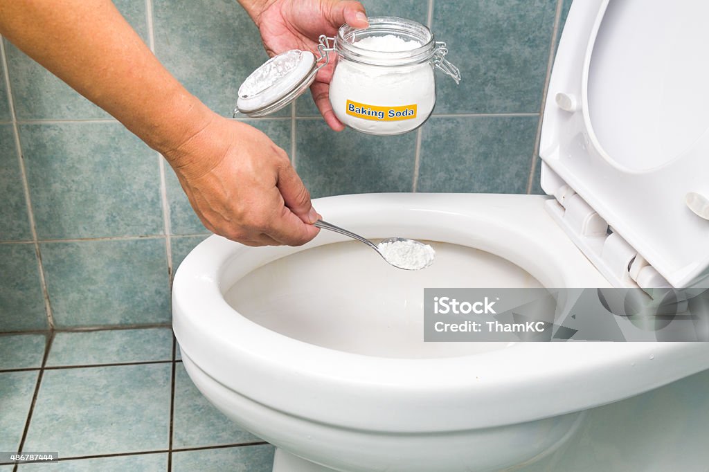 Baking soda to clean and disinfect bathroom and toilet bowl Baking soda used to clean and disinfect bathroom and toilet bowl Toilet Stock Photo