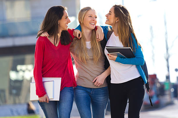 istock Friends talking in the street after class 486787727