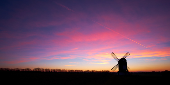 The Winter sun has set on Pitstone Windmill in the Chiltern Hills, deep in the English countryside.   