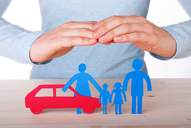 istock Hands Guarding Family and Car 486787909