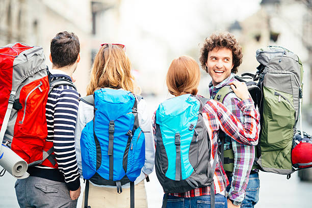 istock Rear view of young backpackers in the city. 486788215
