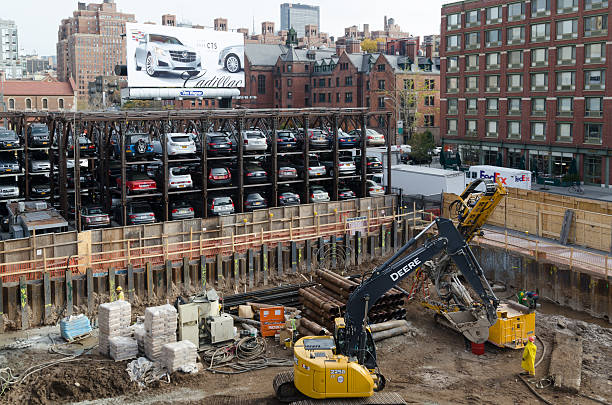 New York City, USA - July 25, 2018: Construction works on Fifth Avenue (5th Avenue) with heavy industrial machines and workers in Manhattan in New York City, USA