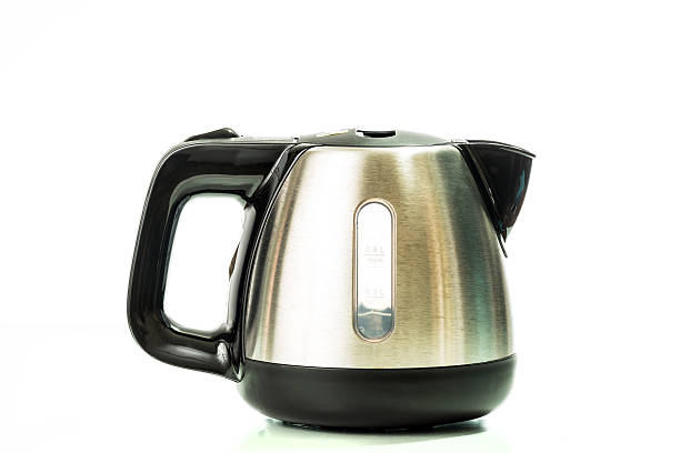 stainless electric kettle isolated on white background stock photo