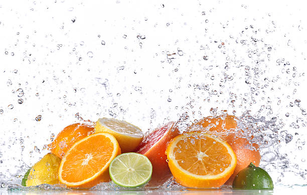 フルーツ水「スプラッシュ」 - grapefruit citrus fruit water fruit ストックフォトと画像