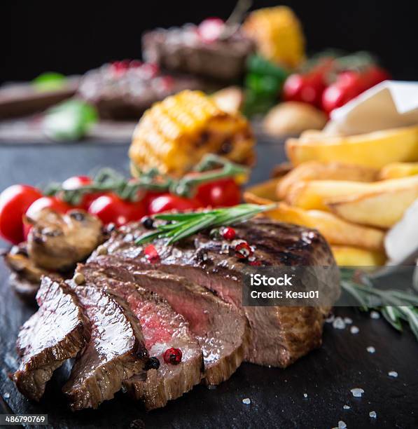 Beef Steak On Wooden Table Stock Photo - Download Image Now - Barbecue - Meal, Beef, Close-up