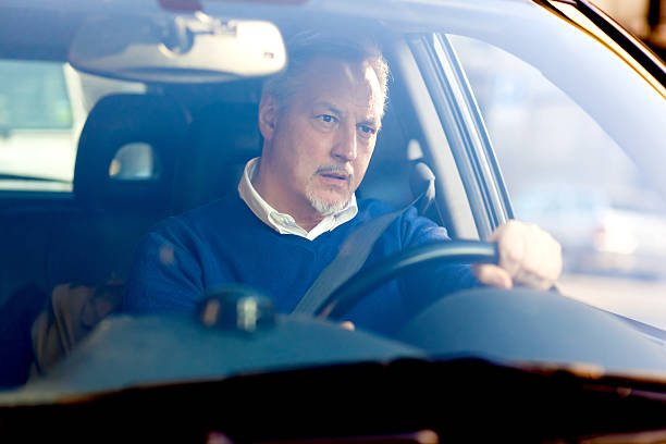 istock Bored man driving his car 486790827