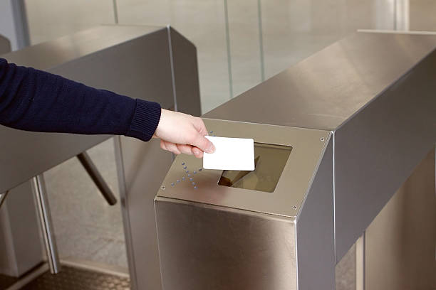 istock Woman's hand puts white plastic card to reader closeup 486791099