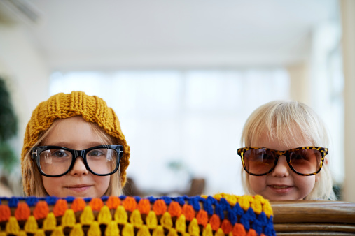 Little fashion girls in too big glasses