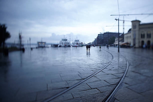 istock Couple walking around Oslo harbor on a melancholic rainy day 486791673
