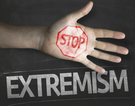 Educational and Creative composition with the message Stop Extremism on the blackboard