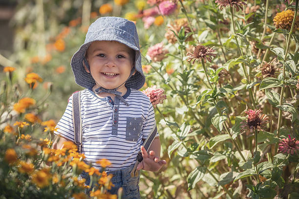 istock baby boy in flowers 486792088