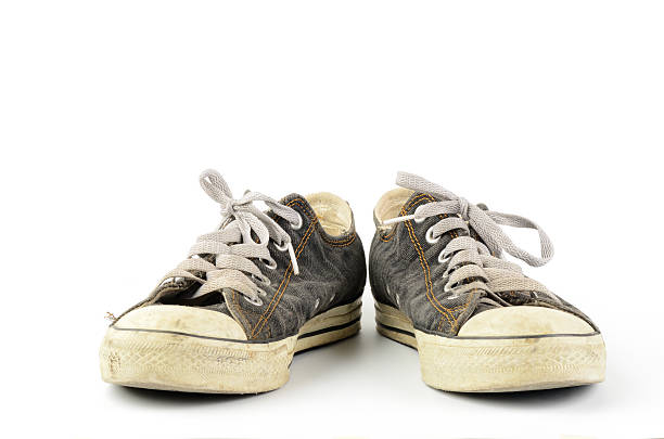 Old sneaker Old sneakers isolated on white background kids dirty shoes stock pictures, royalty-free photos & images