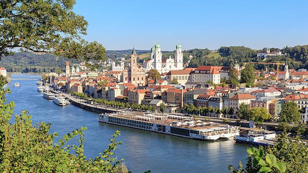Passau at the Danube River View on the city of Passau and the danube with some cruise ships danube river stock pictures, royalty-free photos & images