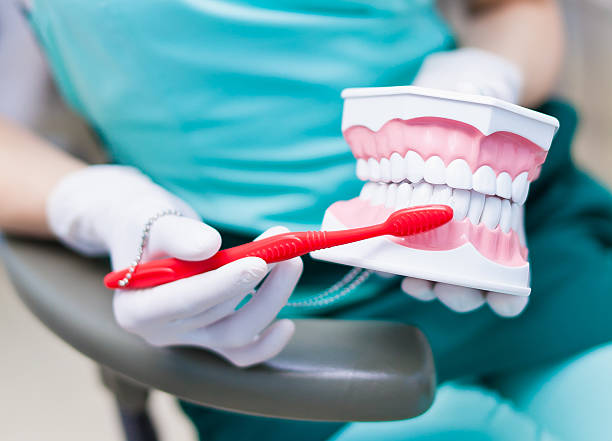 Right technique of cleaning teeth performed by professional dentist
