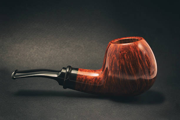 istock Tobacco pipe on a dark background, handmade 486798886