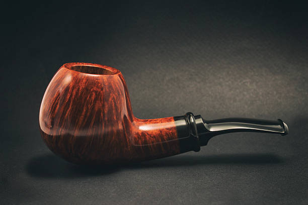 istock Tobacco pipe on a dark background, handmade 486798980