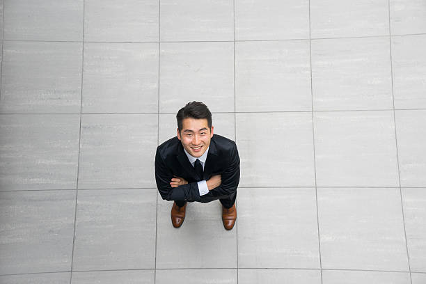 istock Young asian businessman using tablet, mobile phone in the office 486800874