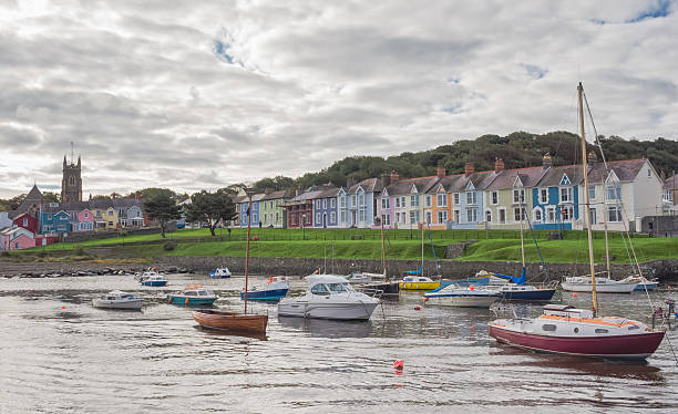 The harbour of the town of Aberaeron View from the harbour on the colorful Regency style houses of Aberaeron in Wales cardigan wales stock pictures, royalty-free photos & images