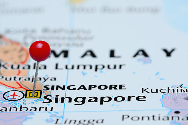 Singapore pinned on a map of Asia Photo of pinned Singapore on a map of Asia. May be used as illustration for traveling theme. singapore map stock pictures, royalty-free photos & images