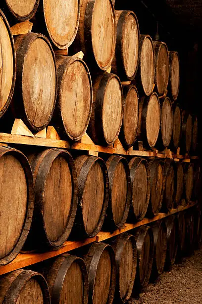 cellar with barrels of wine without labels