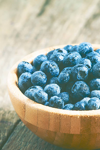 istock Fresh blueberry in a wooden bowl 486804124