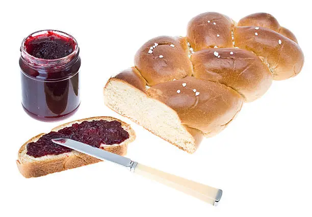 Wheat bread slice (yeast braid) with cherry jam
