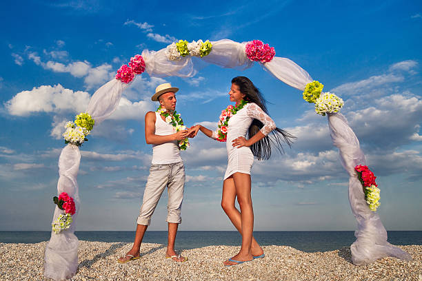 istock Newlywed couple in Hawaiian Hula 486806975