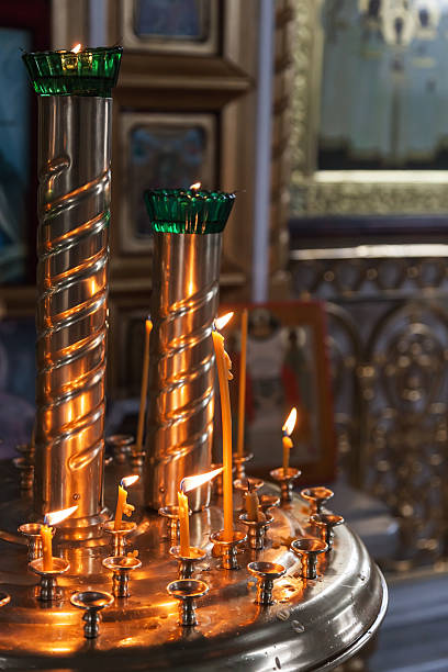 istock Candles are lit in a dark Orthodox Church 486807077