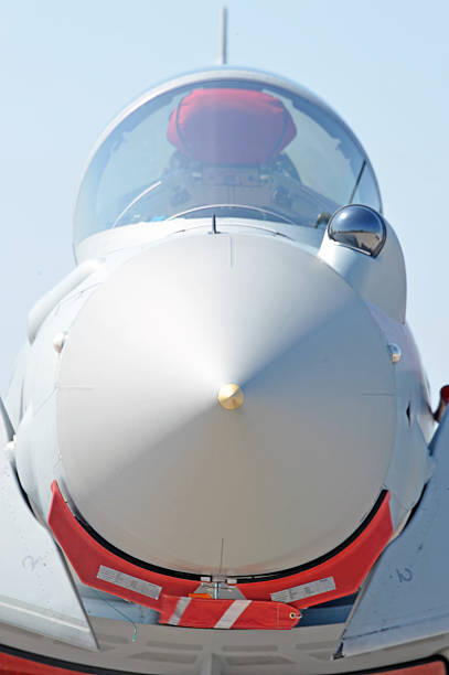 Typhoon nosecone and cockpit Coningsby, Lincolnshire, United Kingdom - May 31, 2013: Eurofighter single and twin seat Typhoons are Europe's latest front line multi-role combat aircraft. These of 29 Squadron RAF sit fuelled for immediate readiness on the flightline british aerospace stock pictures, royalty-free photos & images