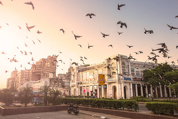Connaught Place, New Delhi, India during the early morning. Typical Georgian buildings are seen in the front. These are the commercial areas. The famous "Statesman Building" is seen in the background. Shot taken from the inner Circle or Rajiv Chowk.